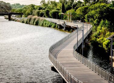 trail winding along the river at Waco Riverwalk